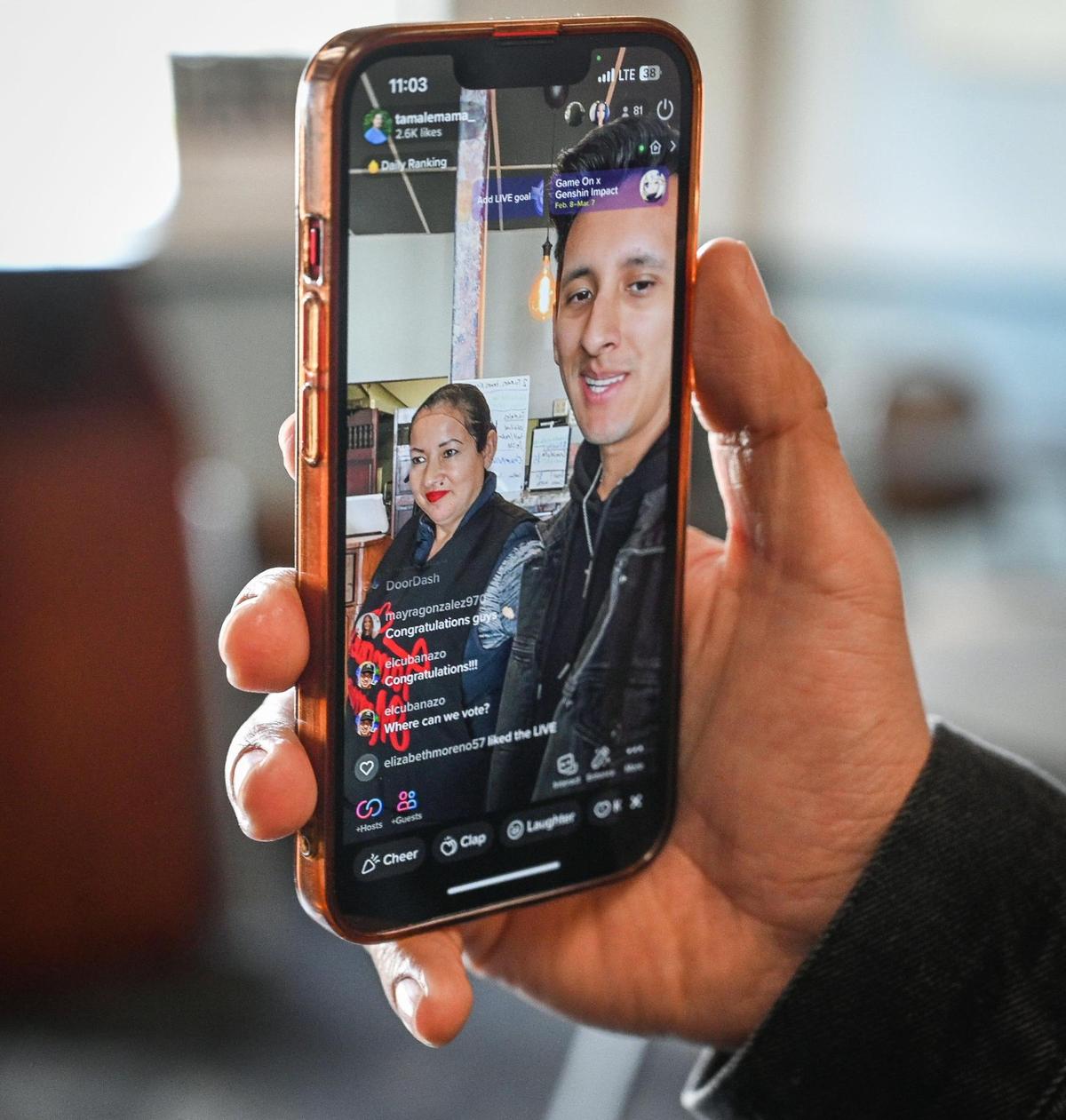 Ruben Vazquez and his mother Cristina Leon start a TikTok live video at the new location of their restaurant Tamale Mama in Fresno’s Chinatown area on Wednesday, March 1, 2023.