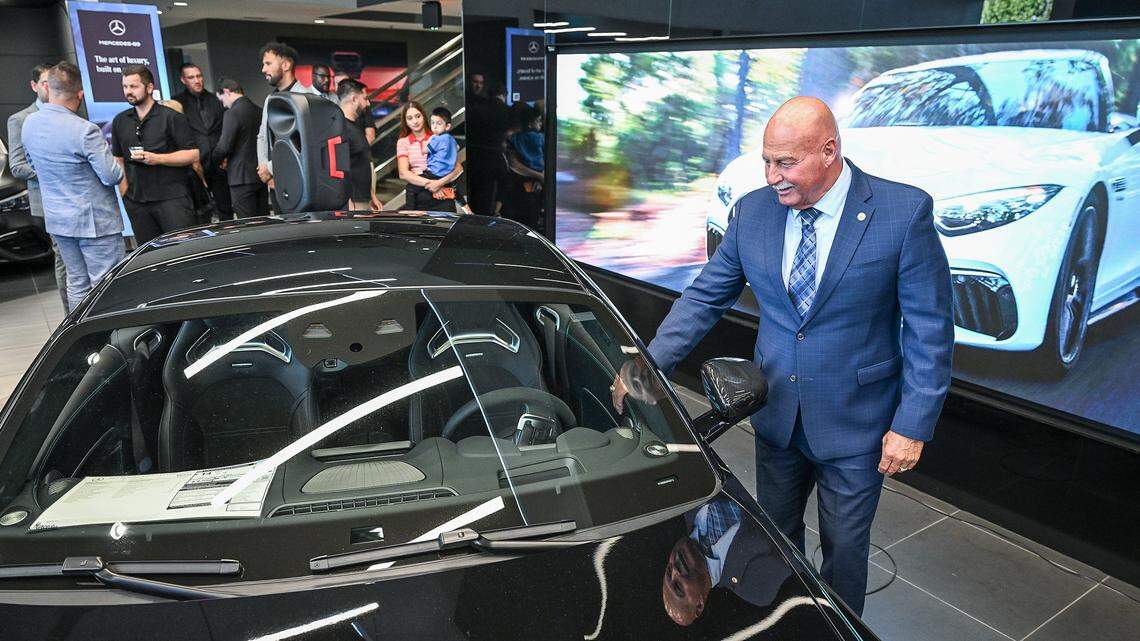Fresno Mayor Jerry Dyer checks out a new Mercedes-Benz AMG GT 63 Coupe during an event to celebrate the newly upgraded Mercedes-Benz of Fresno facility on Tuesday, April 14, 2026. The dealership has recently completed a $4 million renovation to its showroom and service department.