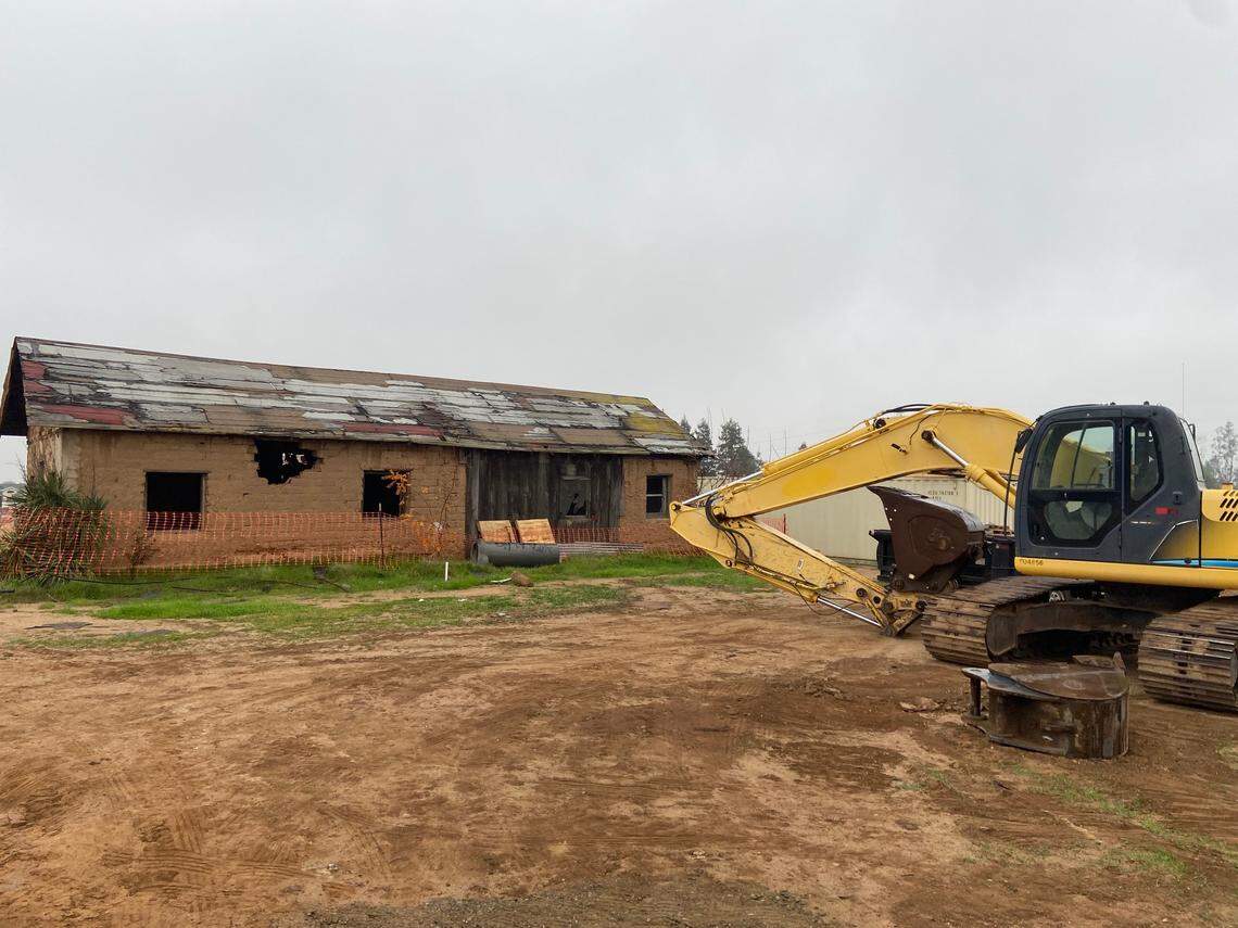 A piece of heavy machinery sits near the Jose Garcia (Brewer) Adobe near Shaw Avenue west of Highway 99 in Fresno, California, on December 5, 2021. The adobe brick and hardpan structure, placed on the Local Register of Historic Resources in 1997, is under threat by a developer who originally requested its demolition.