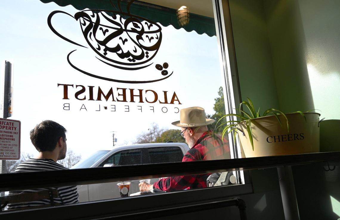 Customers relax outside Alchemist Coffee Lab, a new cafe opened in the space formerly run by Hi-Top Coffee in the Tower District. Photographed Thursday, Jan. 12, 2023 in Fresno.