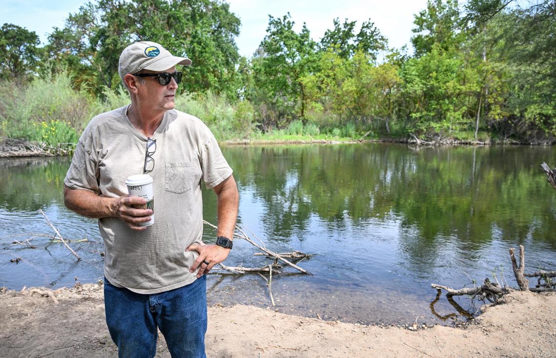 John Shelton, volunteer senior policy advisor for Friends of the River organization, stands on the bank of the San Joaquin River near Woodward Park in Fresno on Wednesday, April 30, 2025.