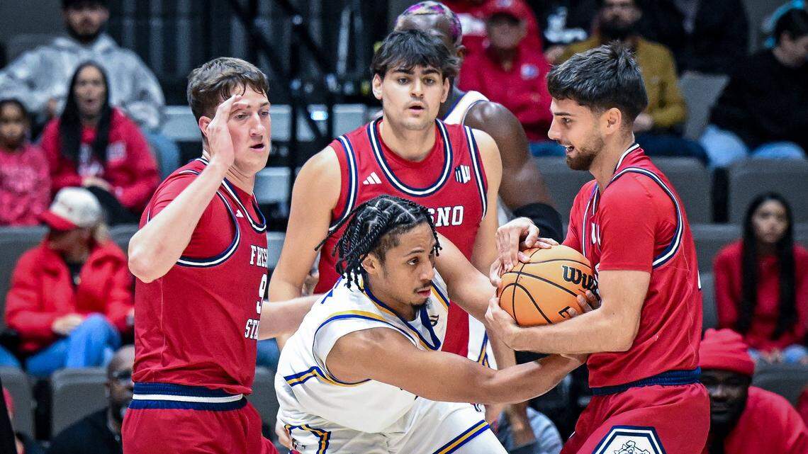 Fresno State's Bastien Rieber, right, rips the ball away from CSU Bakersfield's AJ George during their non-conference game at Selland Arena in downtown Fresno for the “Return to Selland” game on Sunday, Nov. 30, 2025.