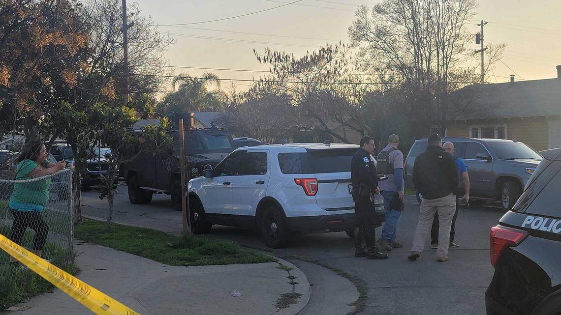 Law enforcement stage in a southeast Fresno neighborhood Thursday, Jan. 27, 2022.