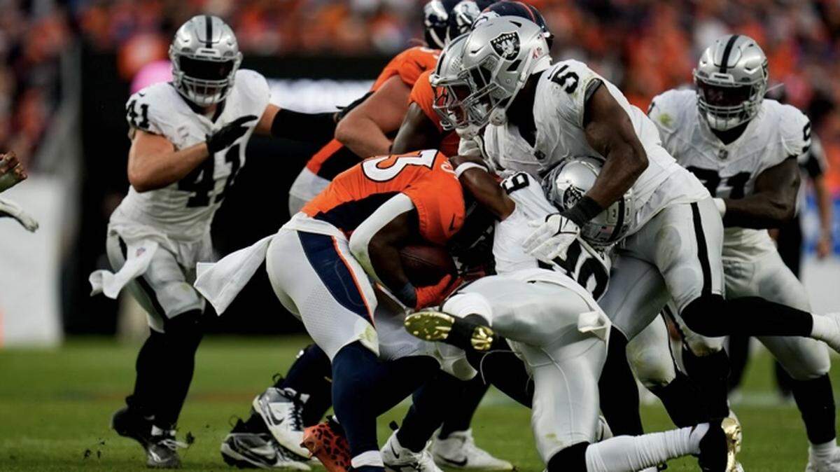 Nate Hobbs and Divine Deablo make a stop during the Las Vegas Raiders’ 17-16 victory over the Denver Broncos on Sunday, Sept. 10, 2023.