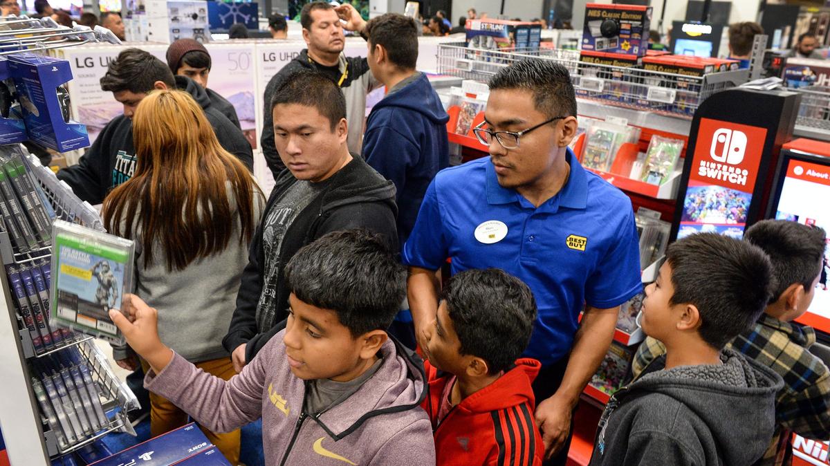 A Best Buy employee helps customers in the store’s video game area on Black Friday, the day after Thanksgiving 2018, at the River Park shopping center. Sales taxes went up by one percent starting Monday, April 1, in several smaller cities in the central San Joaquin Valley after voters approved measure to raise funds for police, public safety and other city services.
