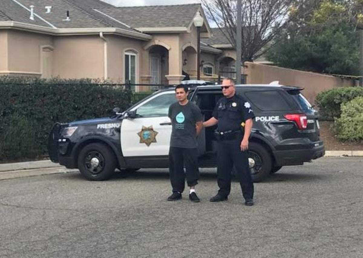 Manuel Bracker is taken into custody after he was arrested in the stabbing of a homeless woman.