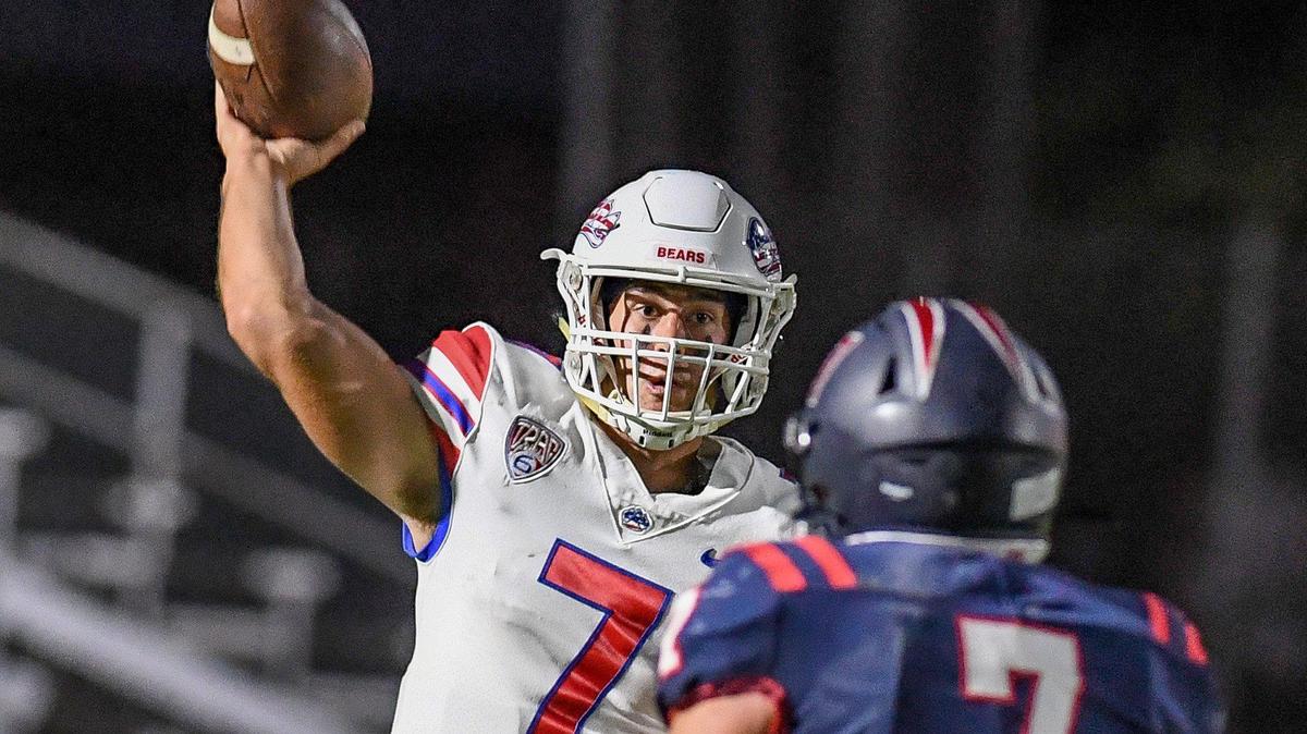 Buchanan quarterback Jayden Mandal throws while getting pressure from Memorial’s Brandon Rangel during their game at San Joaquin Memorial on Friday, Sept. 16, 2022.