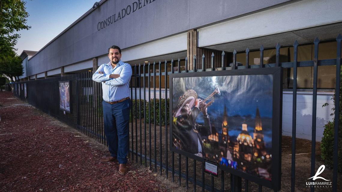 Guadalajara born Mexican photographer Luis Ramírez Corral next to one of the 12 photographs of the ‘Guadalajara, Sister City’ exhibition at the gates of the Consulate of Mexico in Fresno on Ingram Avenue.