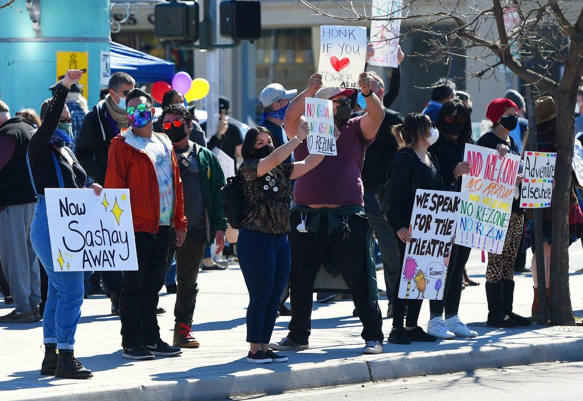 Over 100 people gathered across from the Tower Theatre to protest rezoning and the purchase of the theater by Adventure Church on Sunday morning, Feb. 21, 2021 in Fresno.