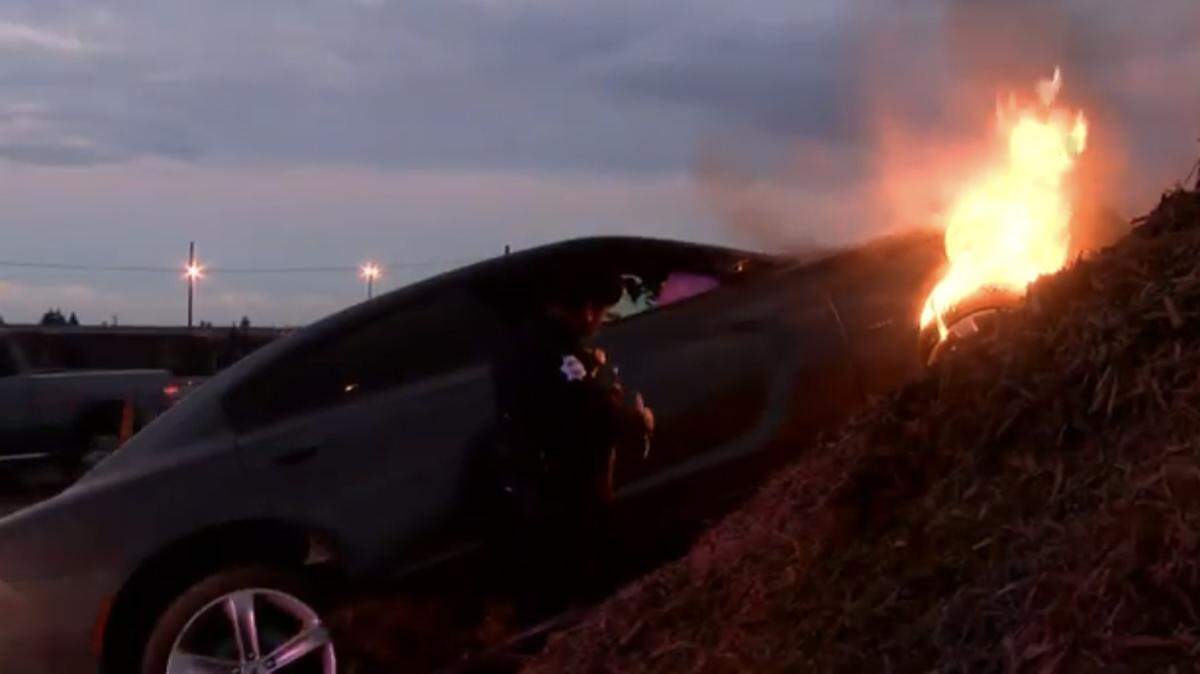 Fresno police said a homeless man who was wearing a mask stole a Dodger Charger from a dealership in northwest Fresno and crashed it about a mile away while trying to get away. The car caught on fire after the crash.