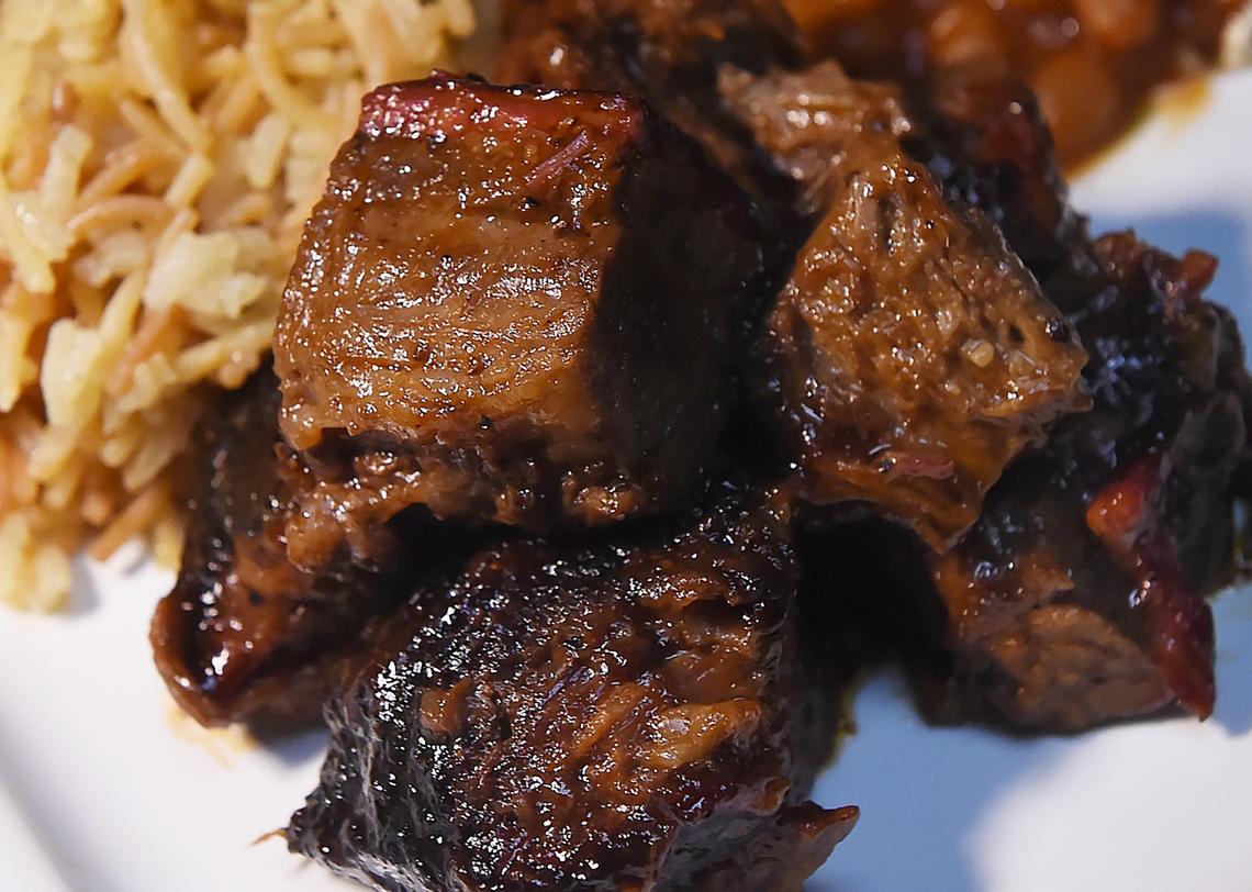 Beef brisket tips, with rice pilaf and beans, photographed at Mega Texas Barbeque Friday, Feb. 1, 2019 in Fresno.