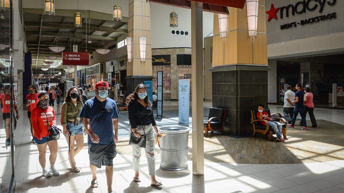 Customers walk through Fashion Fair Mall after the doors opened on Tuesday, May 26, 2020, for the first time since late March due to the coronavirus pandemic.