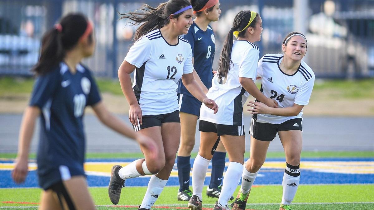 Fresno High’s Mariah Martinez, right, is congratulated by teammates after scoring against Sunnyside during their match at Sunnyside on Wednesday, Feb. 2, 2022.