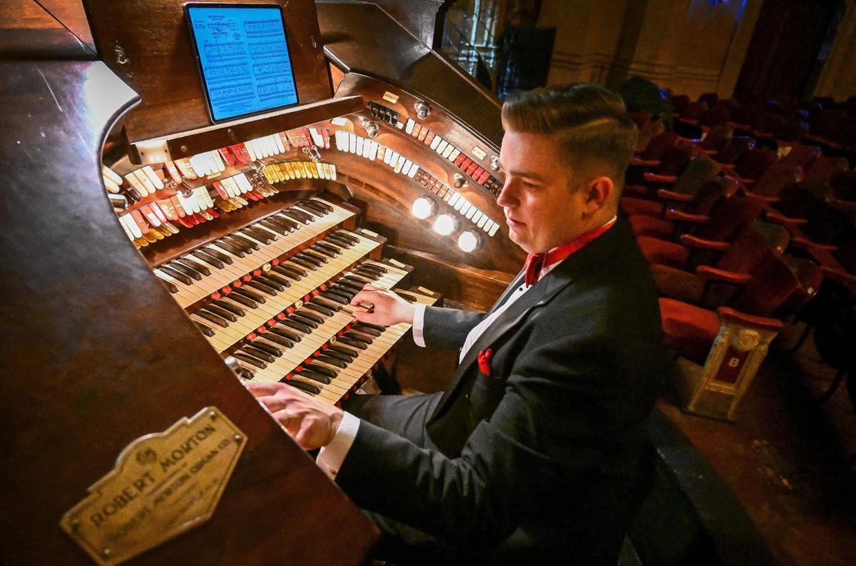 Organist Cactus Harris plays the Robert Morton pipe organ at the historic Warnors Theatre in Fresno on Tuesday, May 21, 2024.