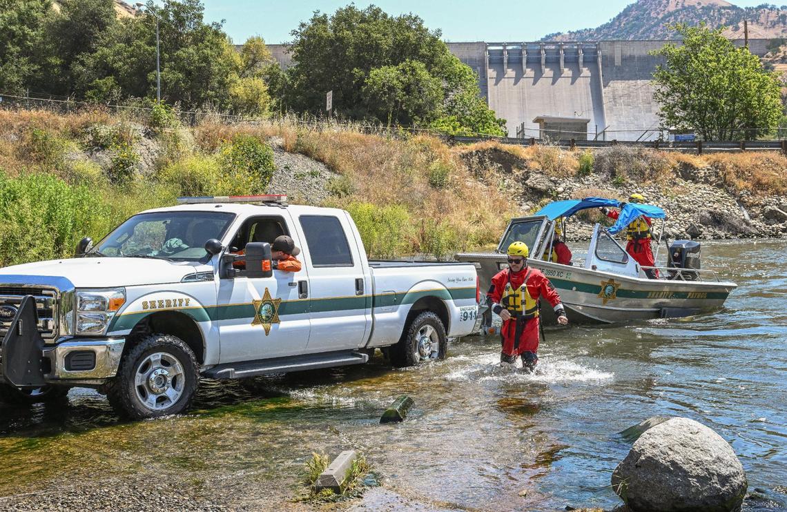 Fresno County Sheriff’s Office search and rescue team members reload their boat onto a trailer near the Pine Flat Dam after reports that a boy’s body had been recovered on the Kings River on Monday, May 22, 2023. A 4-year-old boy and his 8-year-old sister drowned when they fell into the river over the weekend.