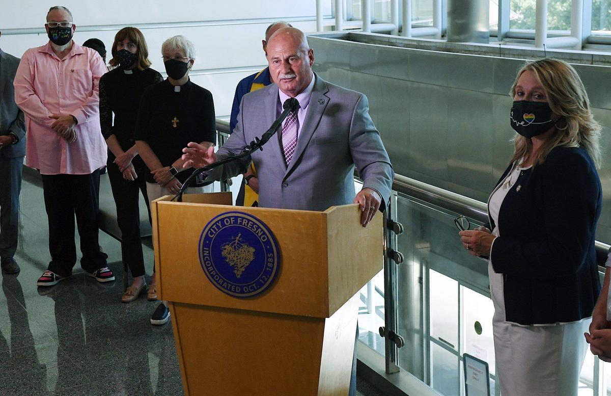 Fresno Mayor Jerry Dyer, center, in a reversal of an earlier decision, announces plans to raise the Pride flag at one of Fresno City Hall’s three flag poles later this month during a press conference Friday afternoon, June 4, 2021 in Fresno. Fresno City College President Dr. Carole Goldsmith, right, also spoke; Dyer credited a campus flag-raising for swaying his mind.