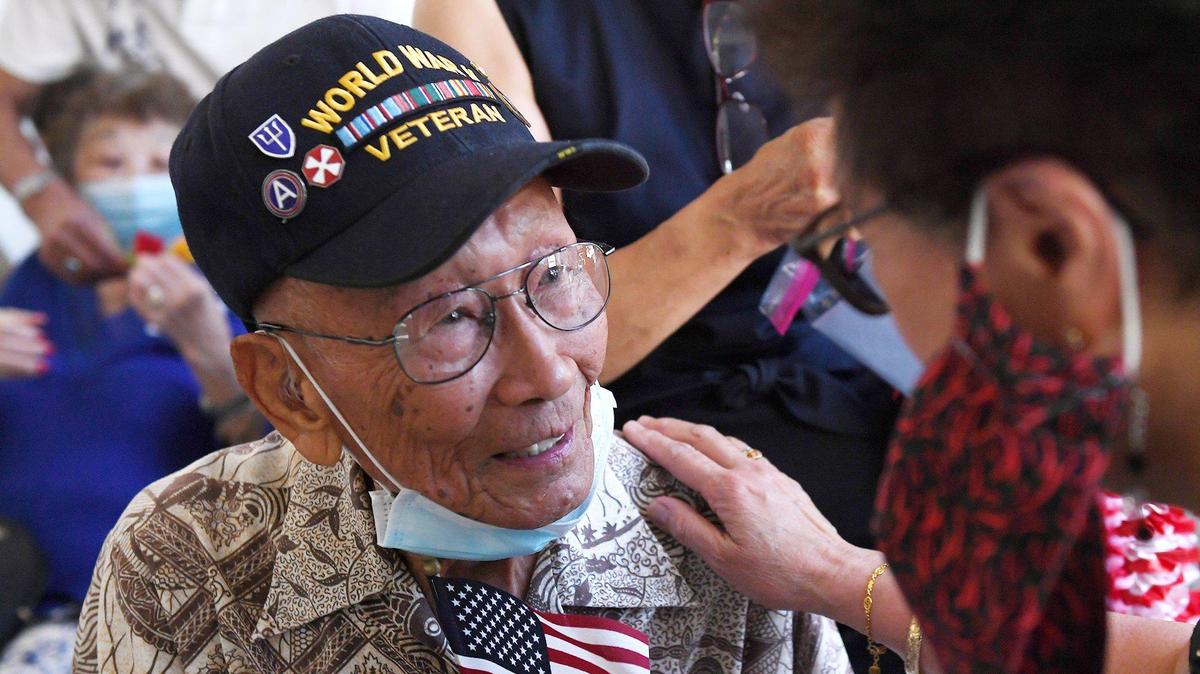 Raymond Lee is greeted before he and three other Chinese American WWII veterans receive medals and recognition in a ceremony atttended by about 150 family and supporters at the Veterans Memorial Museum Saturday morning, June 26, 2021 in Fresno.