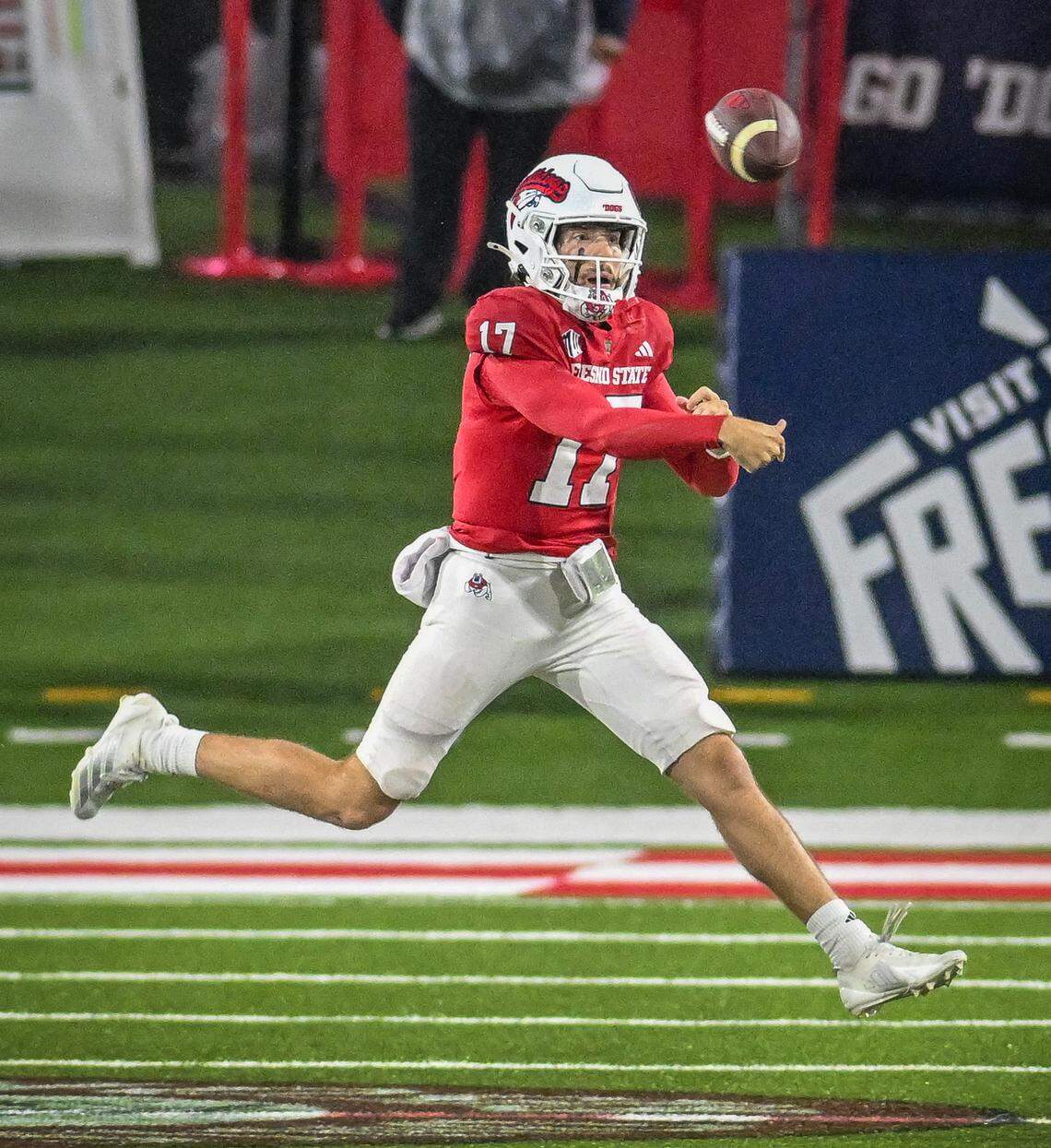 Fresno State quarterback Carson Conklin throws on the run against Wyoming during their game at Valley Children’s Stadium on Saturday, Nov. 16, 2025. 