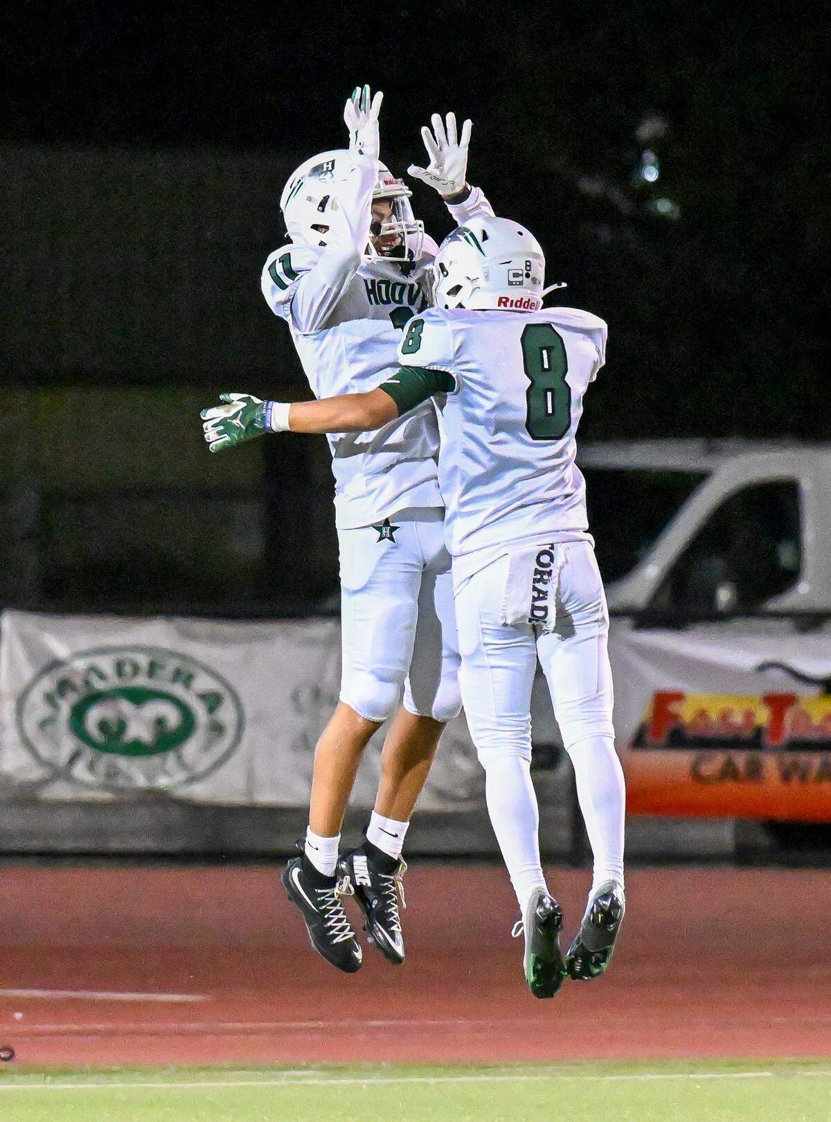 Hoover's Justice Bell, left, celebrates a touchdown catch with teammate Kenneth Aguilera during their game against Madera South at Madera South Stadium on Friday, Sept. 19, 2025.