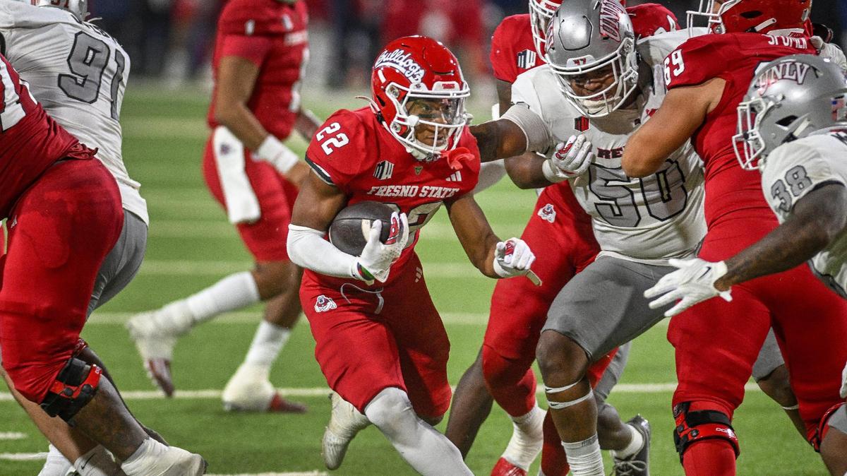 Fresno State running back Malik Sherrod, center, looks for an opening in the UNLV defense near the goal line in the Bulldogs’ 31-24 victory over the Rebels at Valley Children’s Stadium on Saturday, Oct. 28, 2023.