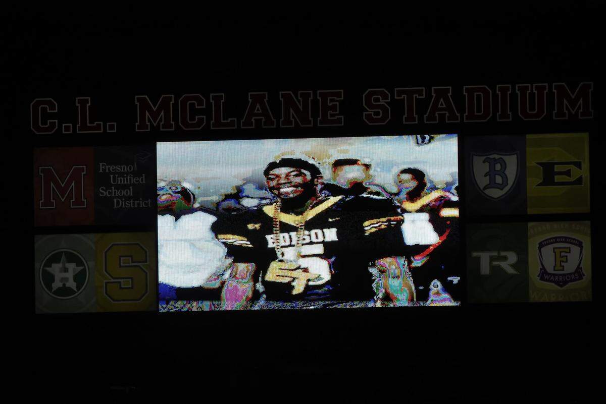 An image of McKinley Lee III is displayed on the McLane Stadium scoreboard on Thursday, Oct. 26, 2023. Lee suddenly died this past week.