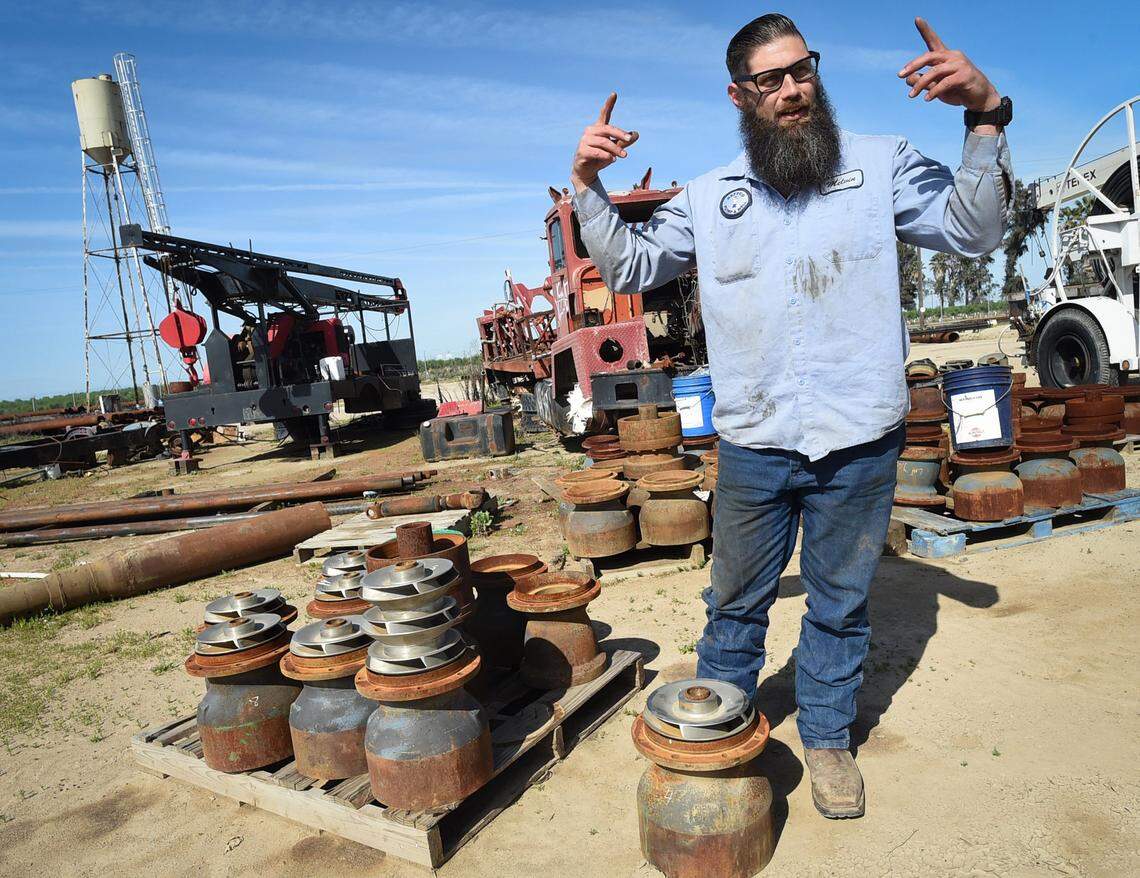 Melvin Smith, who completed the Transition from Jail to Community program at Fresno County Jail, now running his family's well drilling business, talks about a drilling bowl fitting- at his feet- invented by his grandfather.