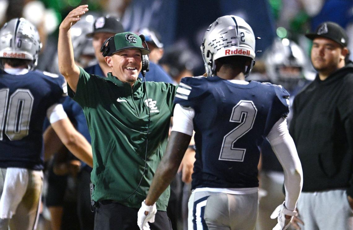 Clovis East’s sideline celebrates Harold Duvall’s 3rd quarter touchdown against Grant Union Friday, Sept. 13, 2024 in Clovis.