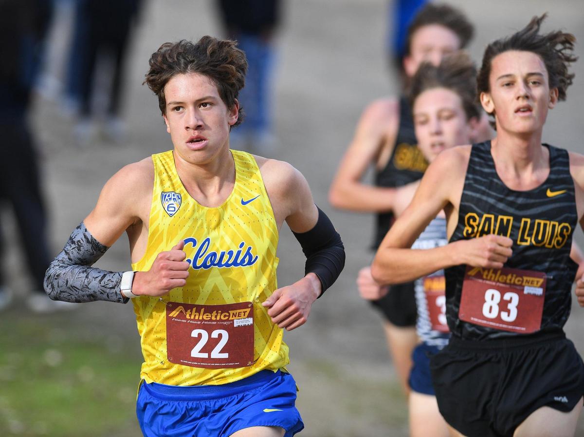 Clovis’ Christopher Caudillo takes the lead going into the final mile in the Central Section boys Division 1 cross country race at Woodward Park in Fresno on Thursday, Nov. 17, 2022.