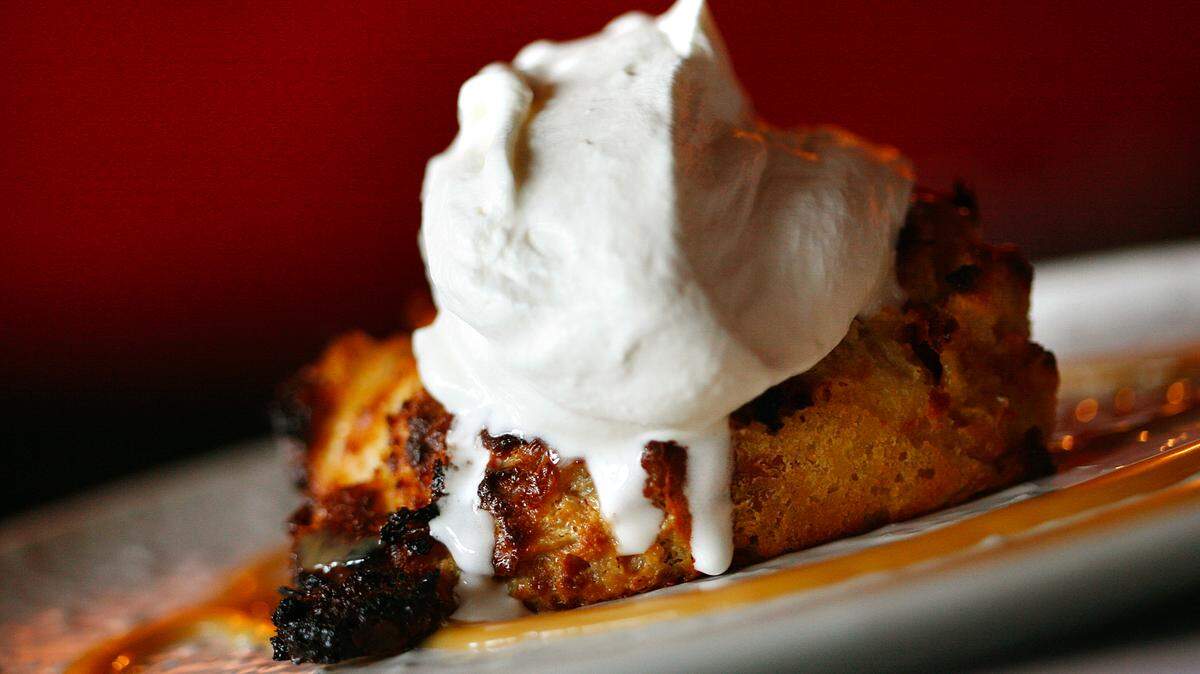 FRESNO, CA 1/7/09 LIF DLW BREAD PUDDING 1 - Bread pudding at the Cracked Pepper Bistro is plated with caramel and whipped cream. - DARRELL WONG/THE FRESNO BEE