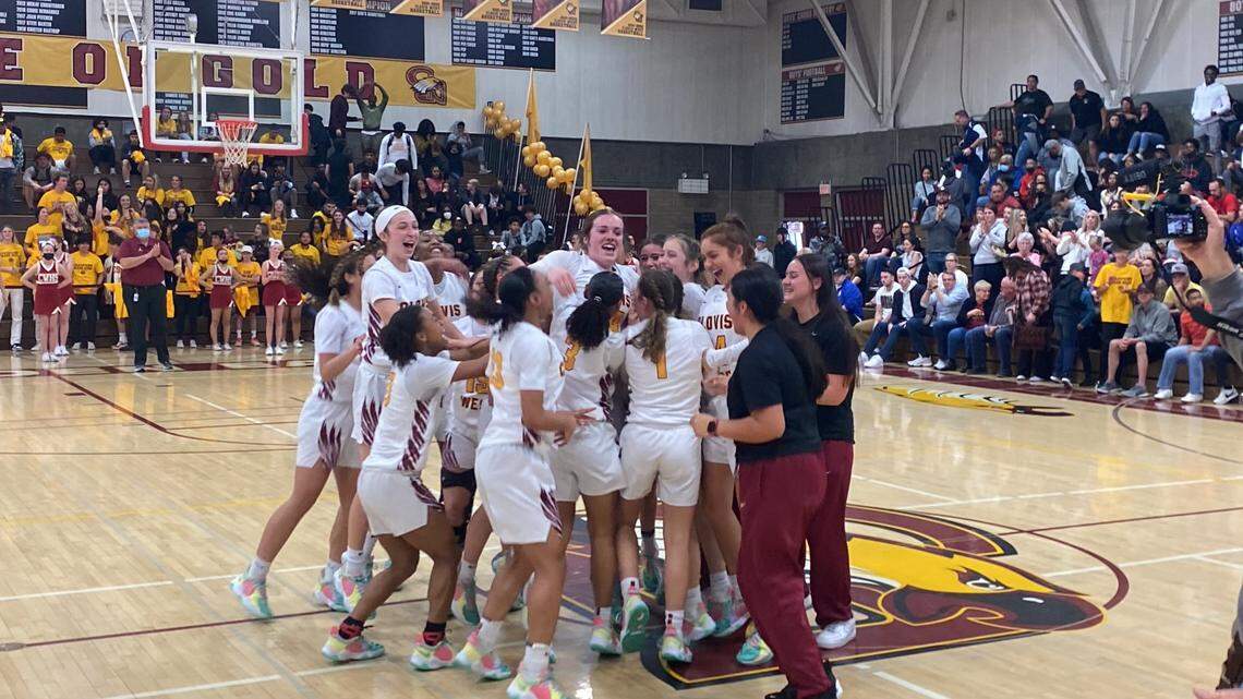 Clovis West High players celebrate after a 49-39 victory over Bakersfield in the Central Section Open Division championship Saturday, Feb. 26, 2022.