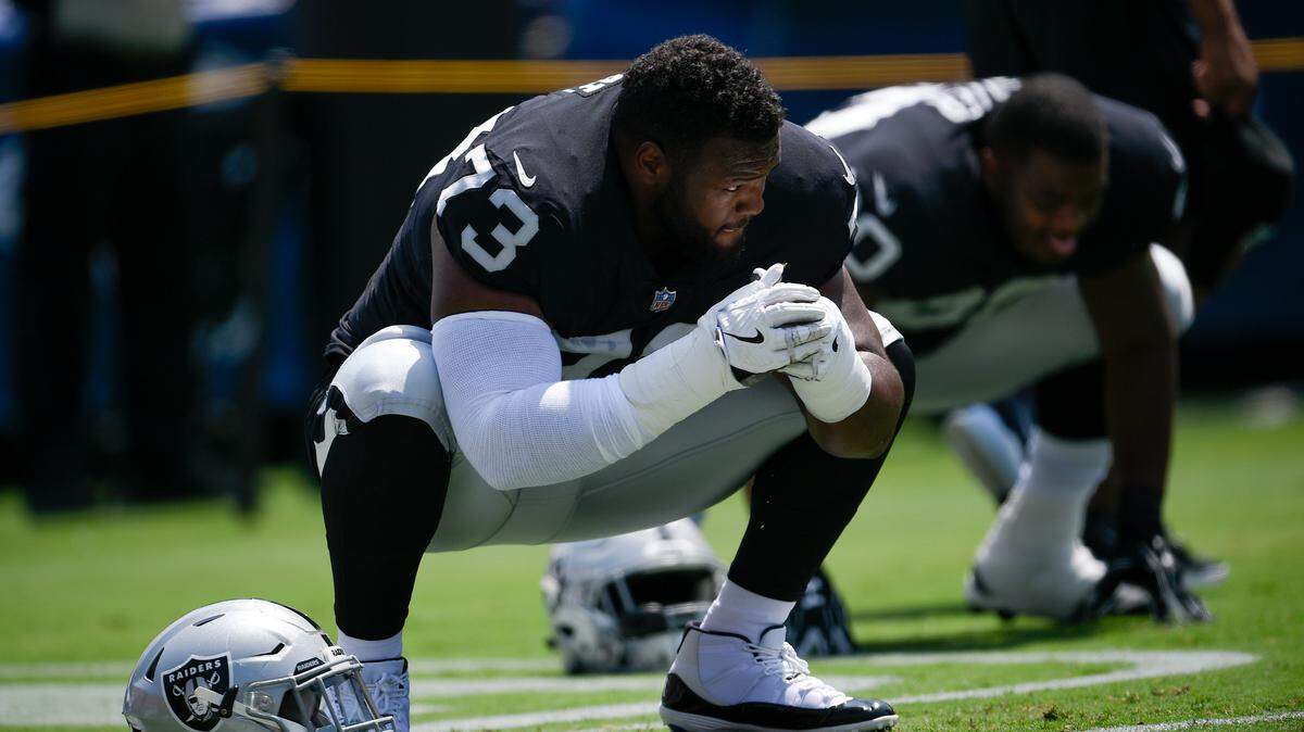 Oakland Raiders defensive tackle Maurice Hurst stretches before an NFL preseason football game against the Los Angeles Rams Saturday, Aug. 18, 2018, in Los Angeles.