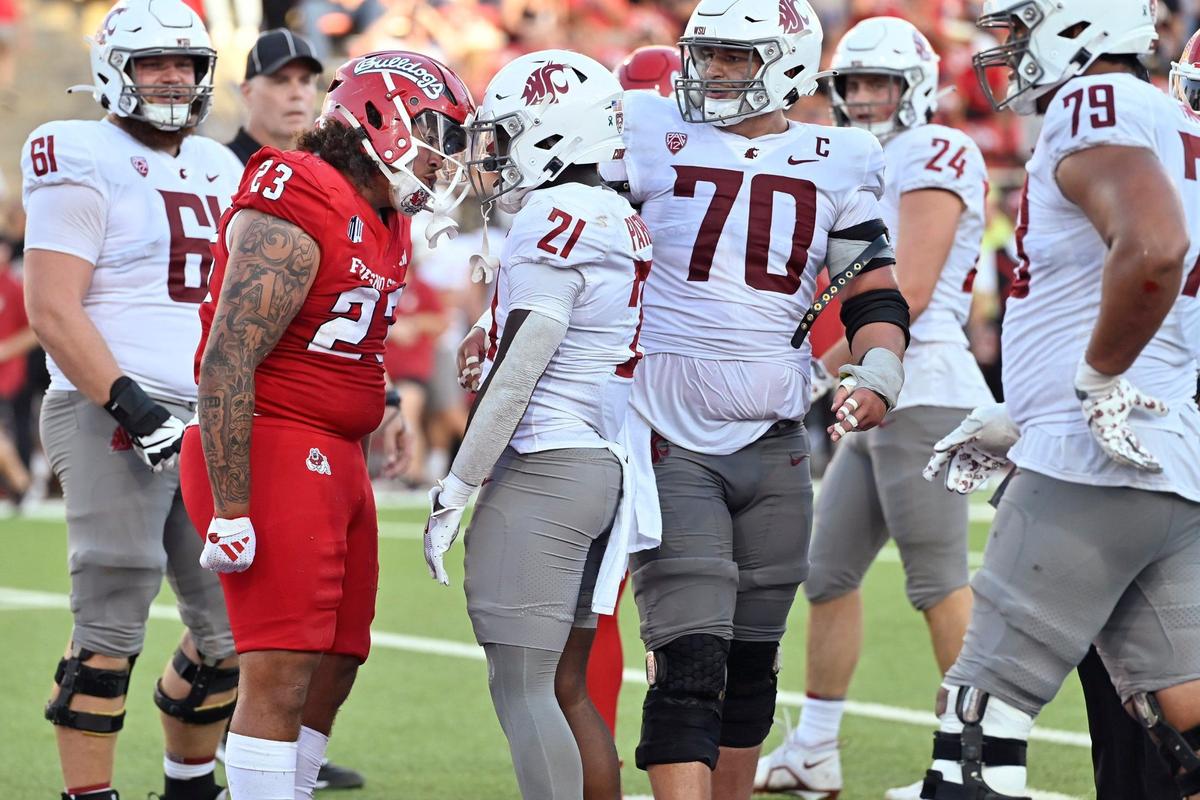 Fresno State’s Jacob Holmes Jr., left, gets in Washington State’s Wayshawn Parker’s face late in the second quarter Saturday, Oct. 12, 2024 in Fresno.