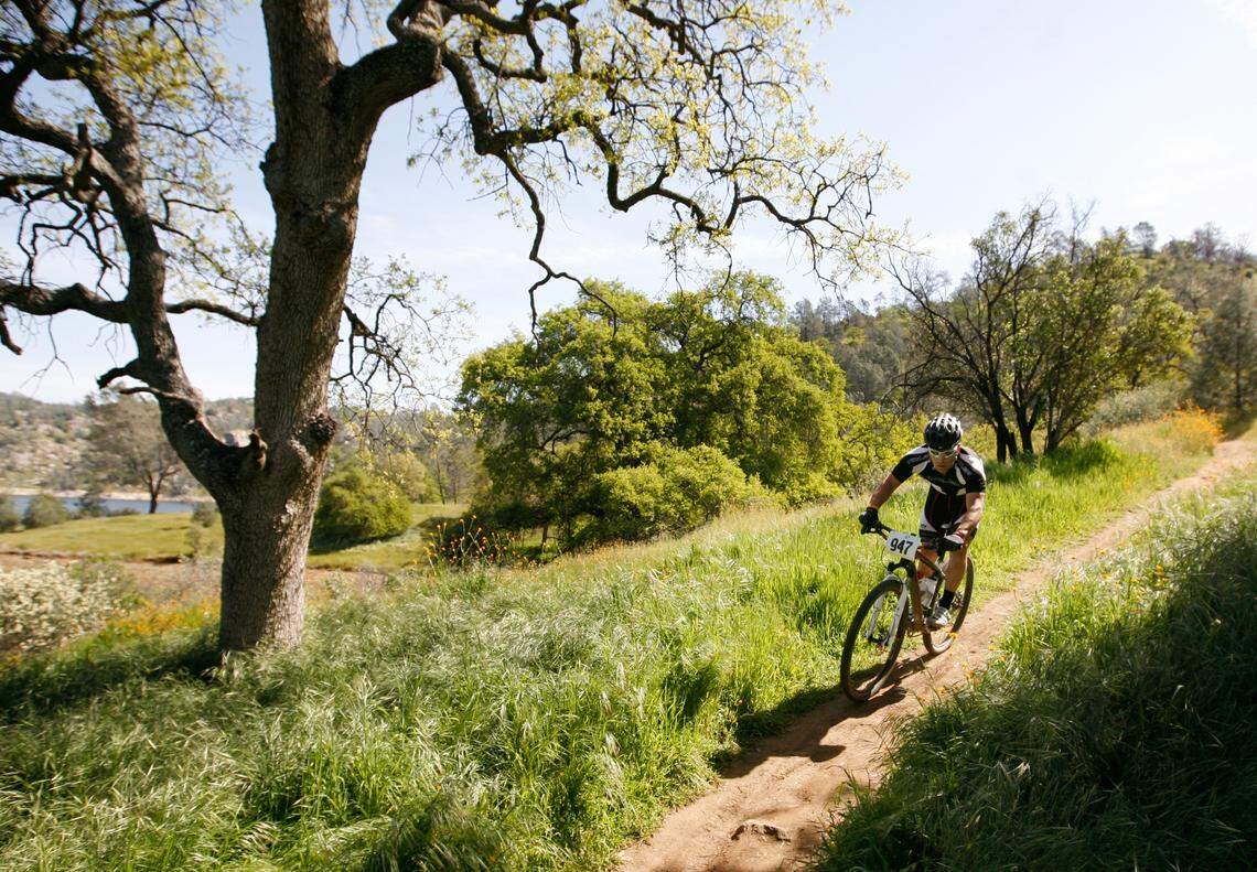 In this 2010 photo, a bicyclist rides through an area formerly known as Squaw Leap Management Area, renamed to San Joaquin River Gorge Management Area.