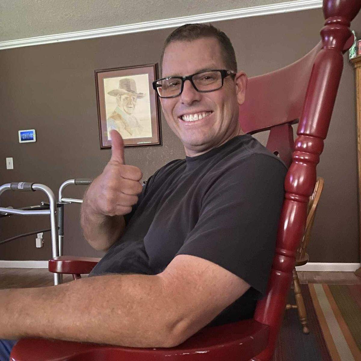 Strathmore High football coach Jeromy Blackwell gives a thumbs up after recovering from a fall that put him in a medically-induced coma in late June 2023.
