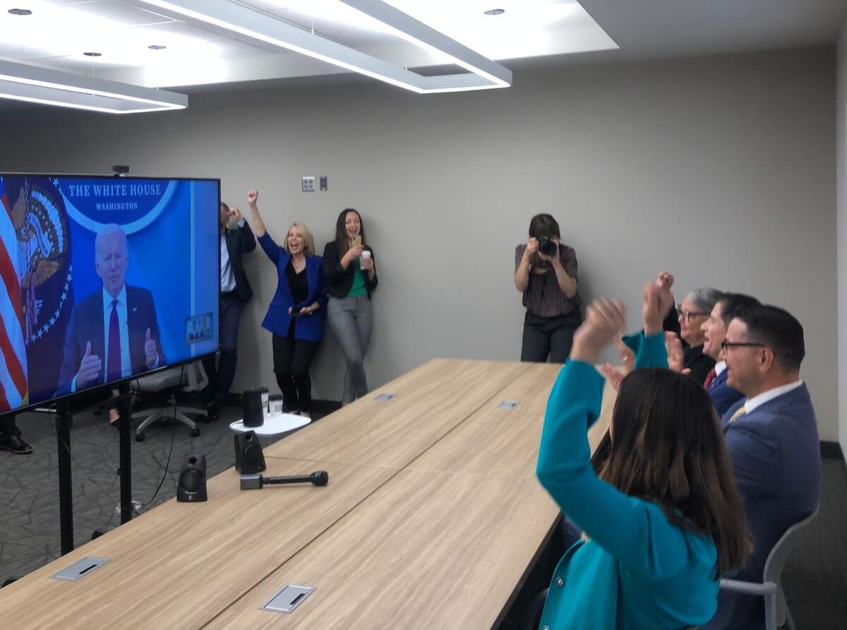 Ashley Swearengin, former mayor of Fresno and president and chief executive officer of the Central Valley Community Foundation, and ‘F3’ coalition members cheer as U.S. President Joe Biden gives a shout out to the “F3” coalition’s $65.1 million dollar federal grant award as part of a Build Back Better Regional Challenge grant program in a virtual meeting on Friday, Sept. 2, 2022.