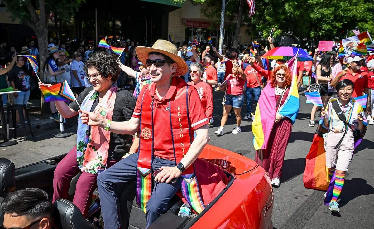 Fresno State President Dr. Saúl Jiménez-Sandoval, rides a convertible representing Fresno State in the Fresno Rainbow Pride Parade with his wife Dr. Mariana Anagnostopoulos, during the annual Fresno Rainbow Pride Parade and Festival in the Tower District on Saturday, June 6, 2026.