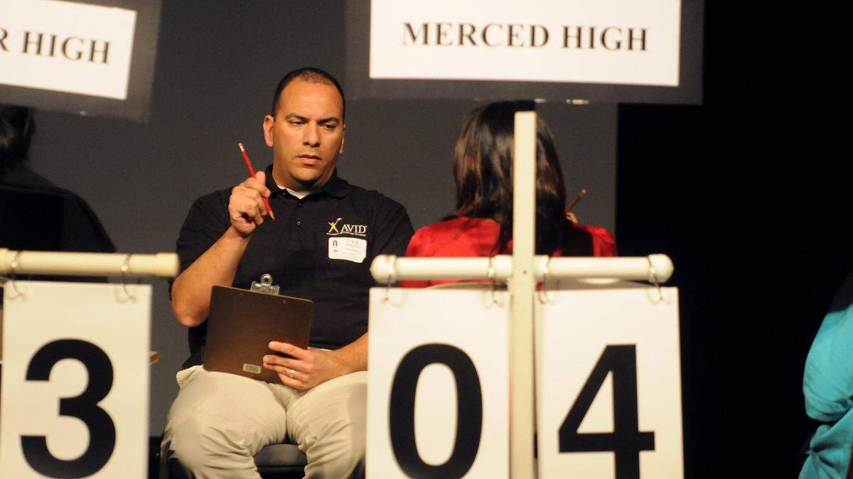 It’s “Pencils up” for local high school students as Craig Chavez waits to check answers for the Super Quiz portion of the 29th Academic Decathlon.