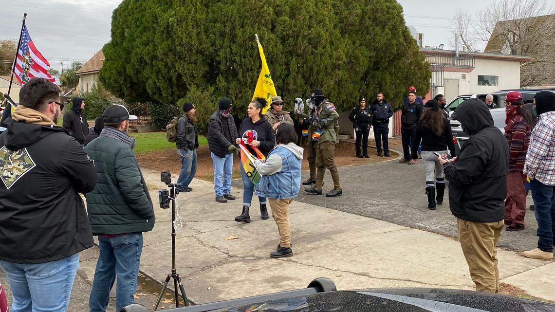 Supporters of the Fresno Drag Festival face off with protestors including members of the Proud Boys on the sidewalk as Fresno police look on in front of Our Saviour’s Lutheran Church in central Fresno on Saturday, Dec. 10, 2022. This was the second year the festival was held at the church.