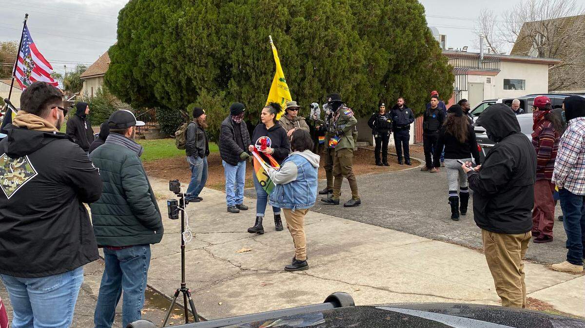 Supporters of the Fresno Drag Festival face off with protestors including members of the Proud Boys on the sidewalk as Fresno police look on in front of Our Saviour’s Lutheran Church in central Fresno on Saturday, Dec. 10, 2022. This was the second year the festival was held at the church.