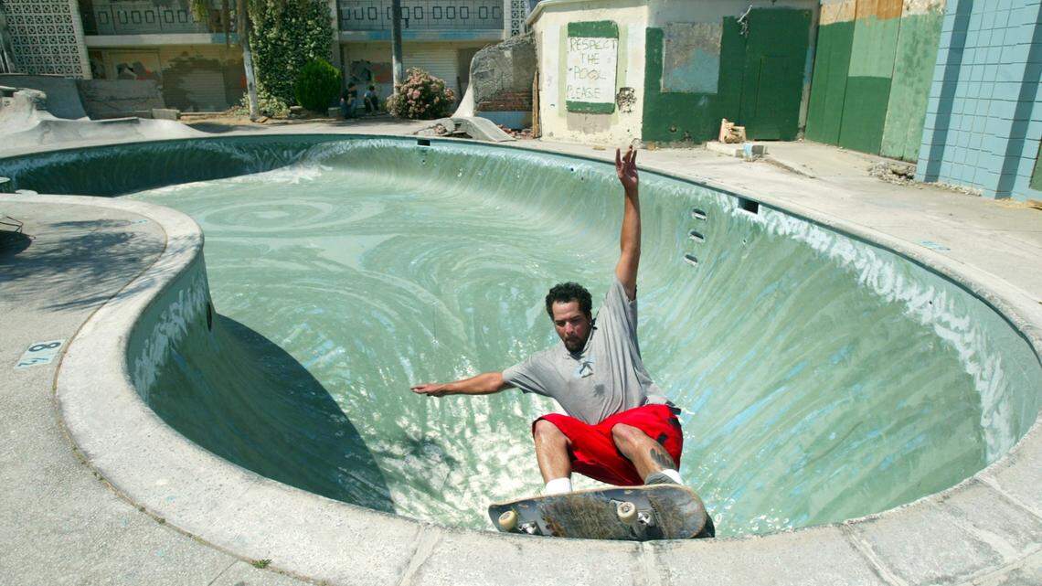In 2004, Jeff Harris of Sacramento rides the lip of the pool at the abandoned Vagabond Motel in Fresno, California. The pool was a West Coast destination spot for skateboarders.