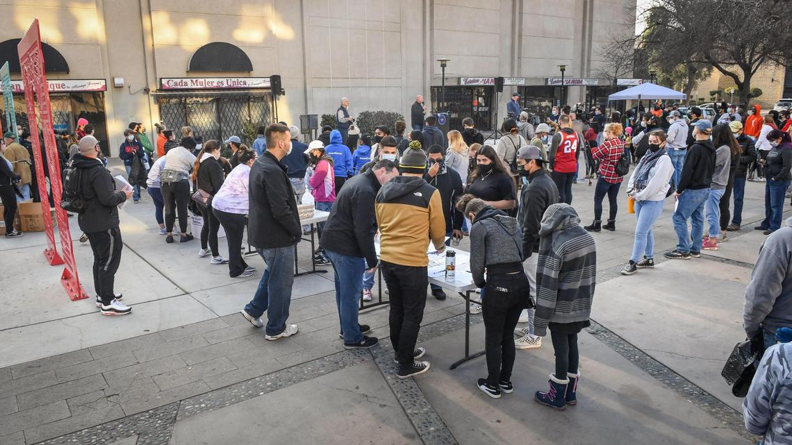 Volunteers gather and sign in at Mariposa Plaza before the start of two cleanup events as a part of Mayor Jerry Dyer’s new initiative, Beautify Fresno, to celebrate the National Day of Service on Martin Luther King Jr. Day, Monday, Jan. 18, 2021. About 200 volunteers signed up for the event to pick up trash in the Fulton District and the Lowell District to honor the legacy of the late Reverend King. On Martin Luther King Jr. Day residents are encouraged to use the holiday as “a day on, not a day off” and look for ways to volunteer to make their communities better.
