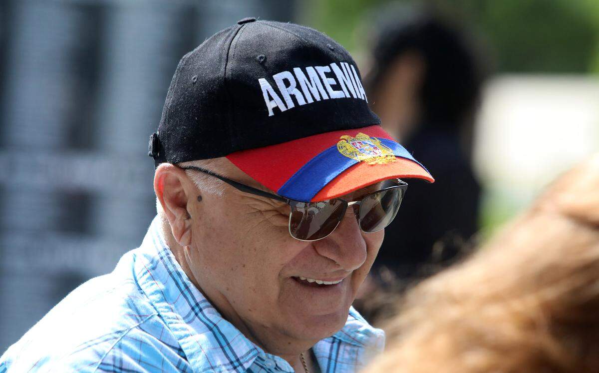A man wears an Armenian-themed cap at the annual Armenian genocide commemoration and flag-raising ceremony at Fresno City Hall on April 24, 2025.
