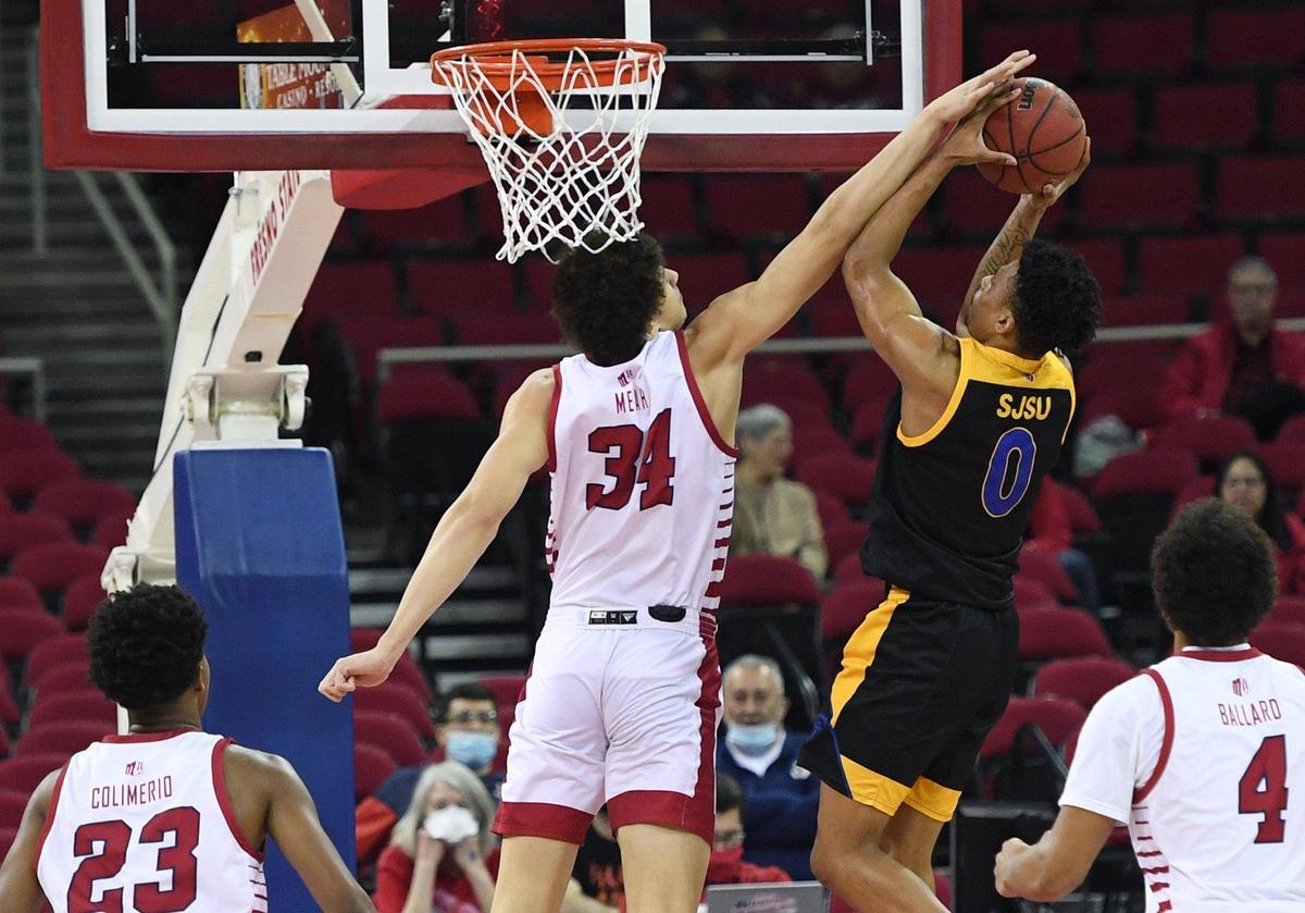 Fresno State’s Braxton Meah, left, covers San Jose State’s Myron Amey, Jr., right, Tuesday night, Jan. 11, 2022 in Fresno. The Bulldogs led the Spartans 39-28 at halftime.