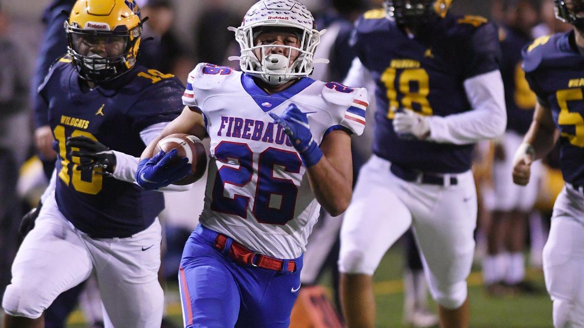Firebaugh’s Danny Olivera, center, outruns the Sunnyside defense for a touchdown in the first quarter in a Central Section Division III playoff game Thursday night, Nov. 4, 2021 in Fresno.