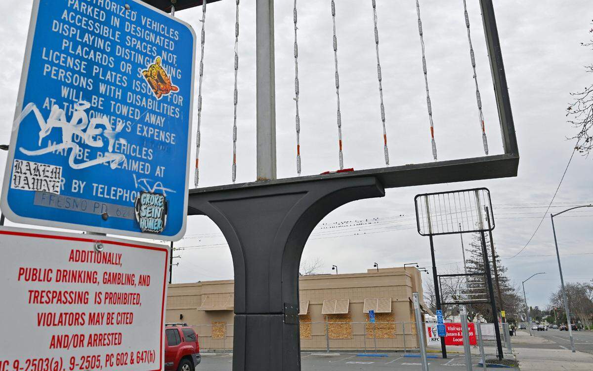 The Wendy's and adjacent KFC on C Street just south of Fresno Street are closed, leaving only the emtpy sign framing on fornt, seen Tuesday, Feb. 10, 2026 in Fresno.