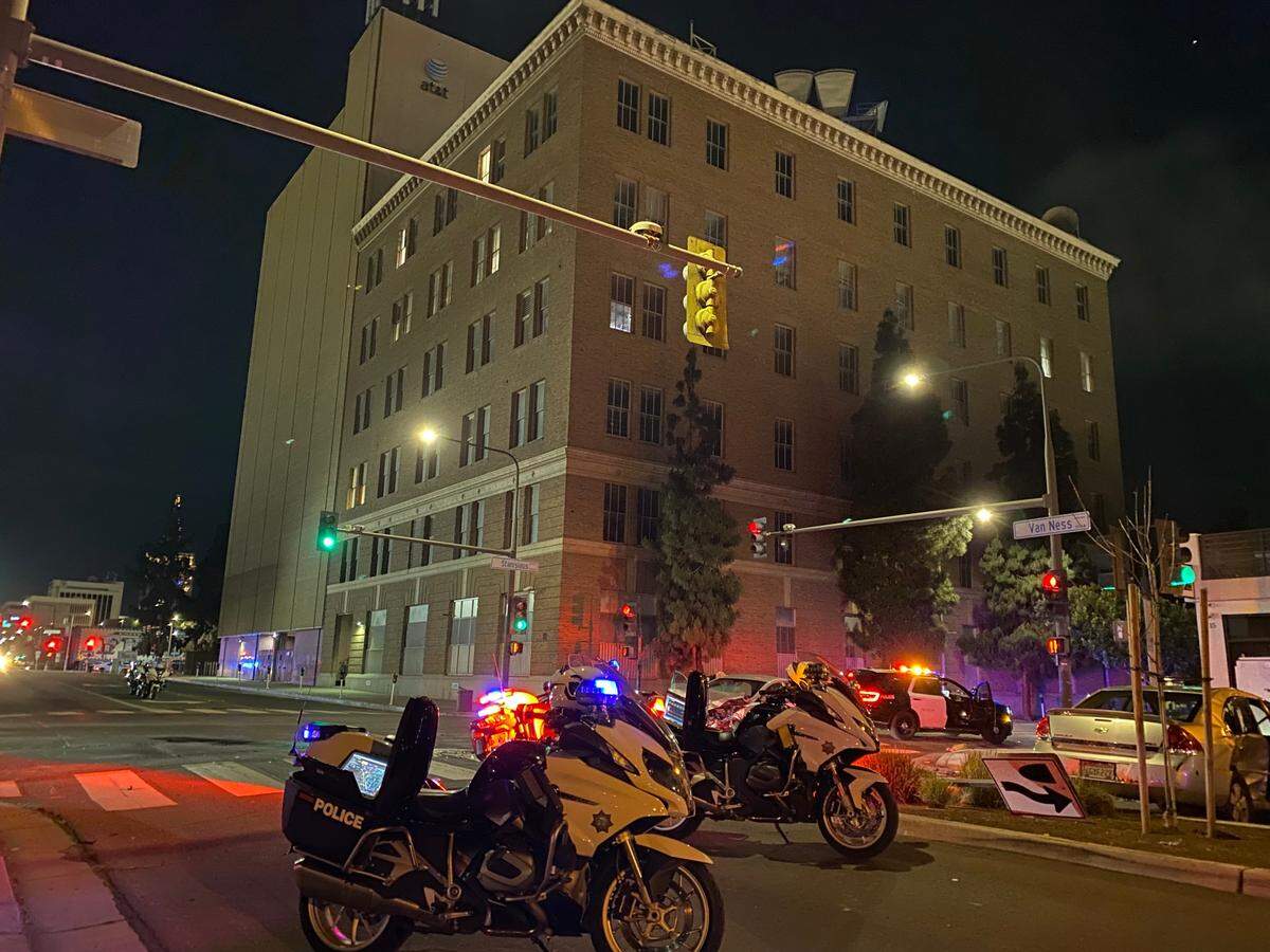 Police investigate a two-vehicle crash in which one of the vehicles was stolen before the collision in Fresno, California on Sunday, March 31, 2024.