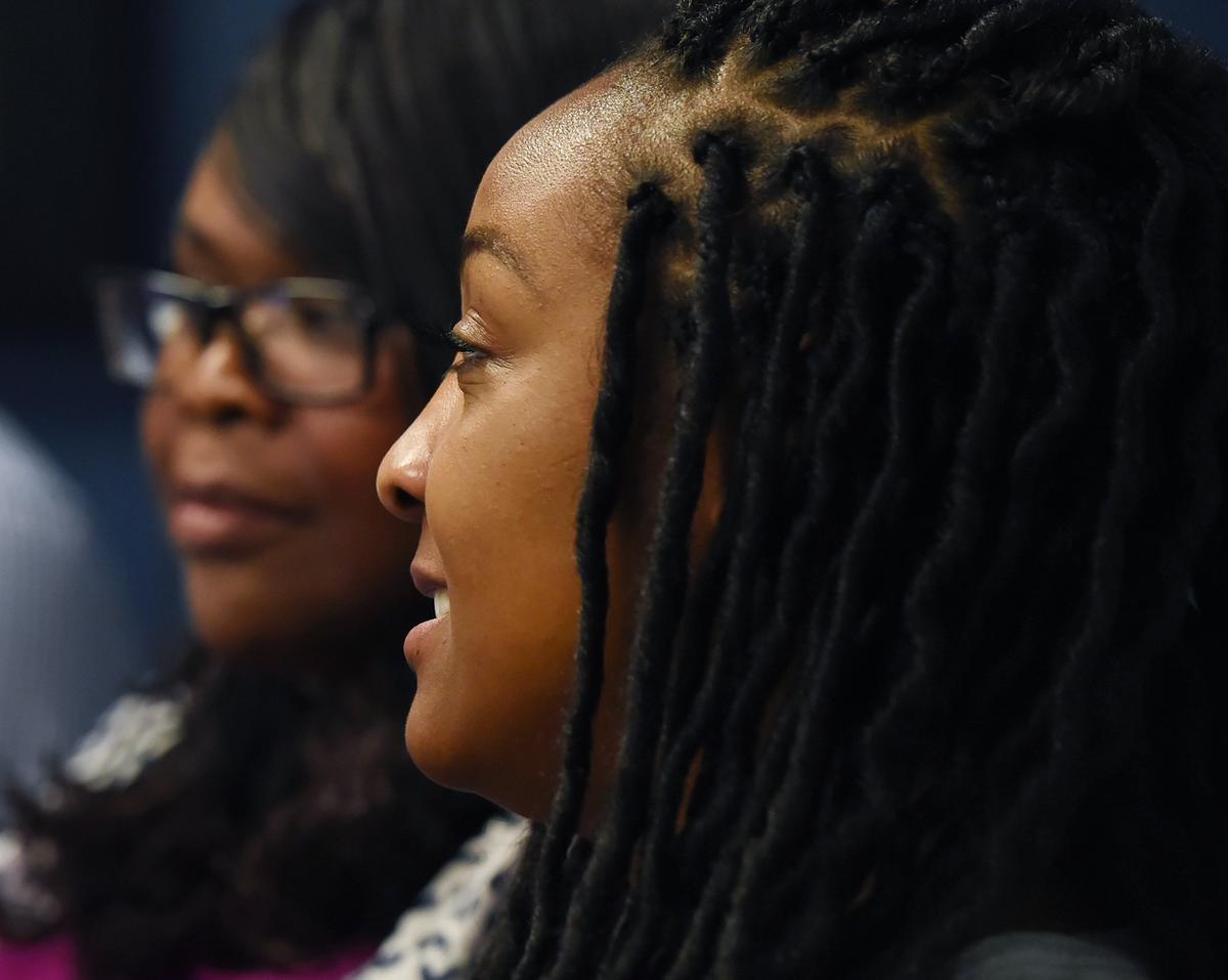 Raynita Nebeker, right, talks about the discrimination she’s endured over her hair during an interview Friday, April 26, 2019 in Fresno.