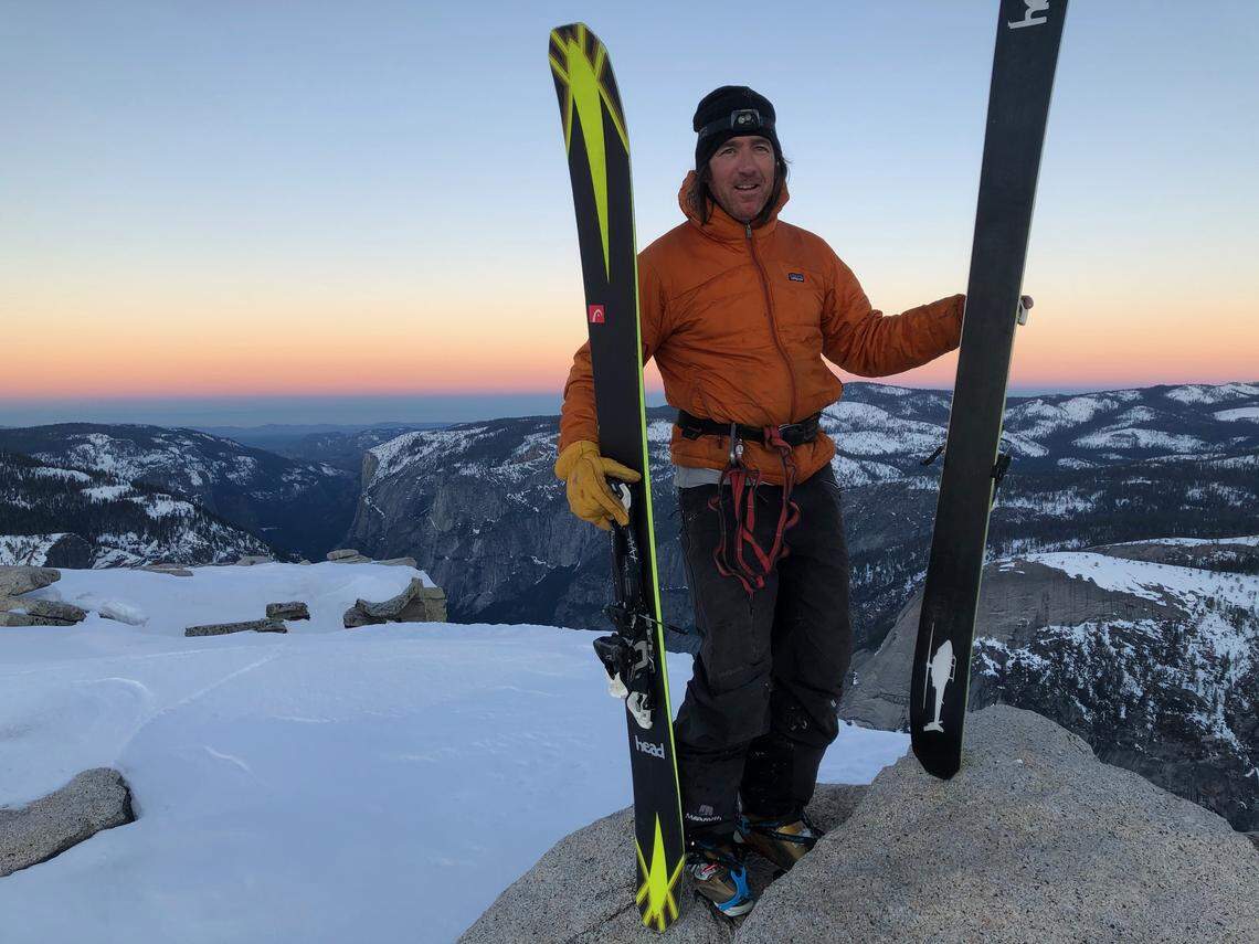 Jason Torlano atop Half Dome at sunrise Feb. 21, 2021 before skiing down it to Yosemite Valley.