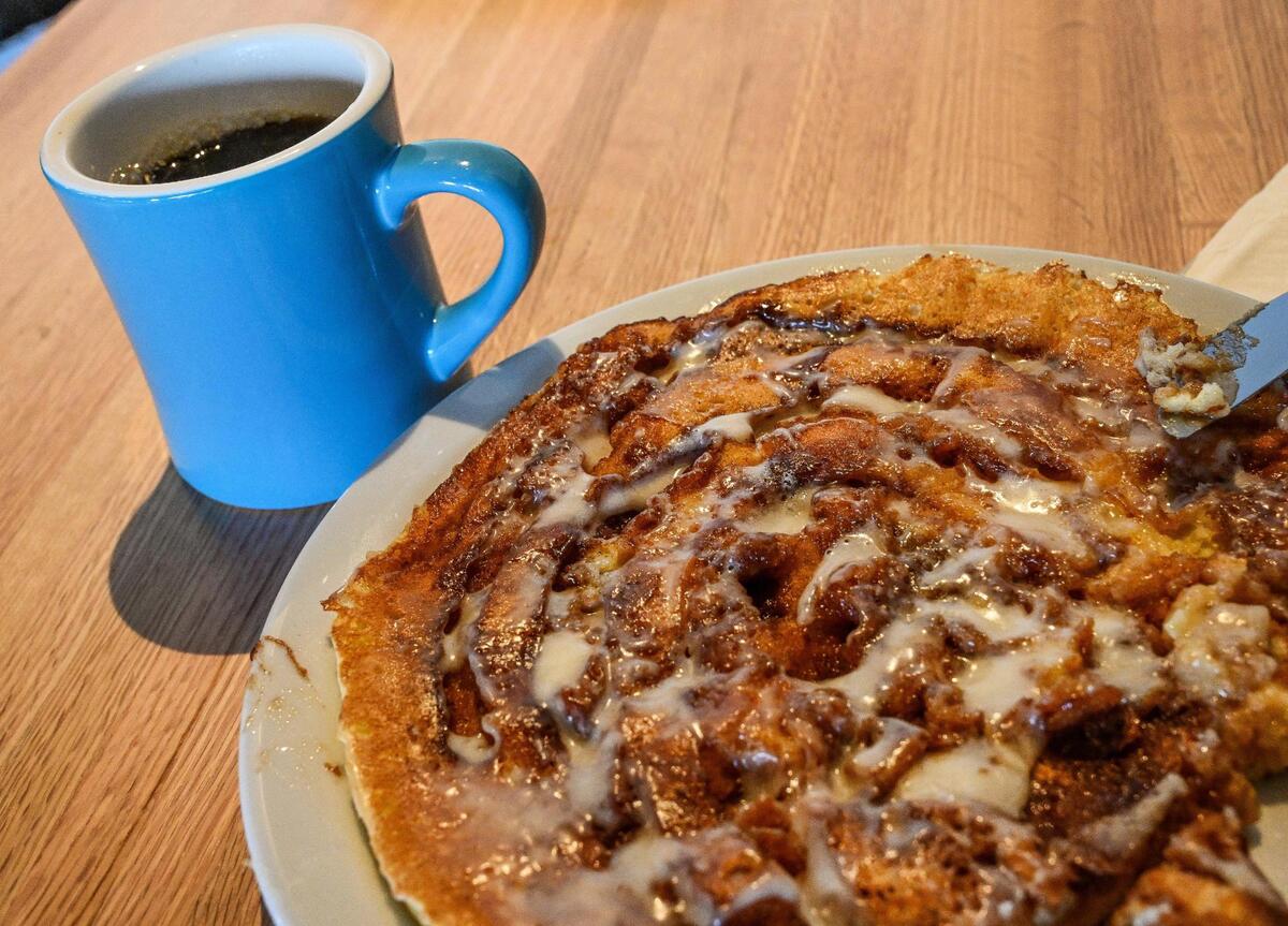A cinnamon pancake featuring handmade ingredients from scratch is paired with a freshly brewed cup of Lanna coffee at Batter Up Pancakes in Clovis in this Fresno Bee file photo from 2023.