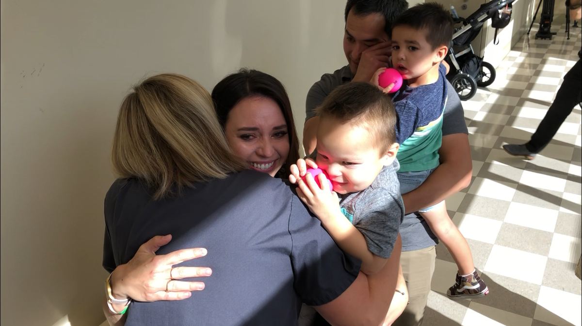Susie LeRoy, 35, hugs the Perry family. LeRoy donated a kidney to Kaleb, 2, who was born with Prune Belly Syndrome, a rare condition that causes severe kidney and lung problems. The staff at Community Regional Medical Center in Fresno, CA, joined Kaleb’s family on Friday, Sept. 6, 2019, for an honor walk to thank LeRoy for her donation.